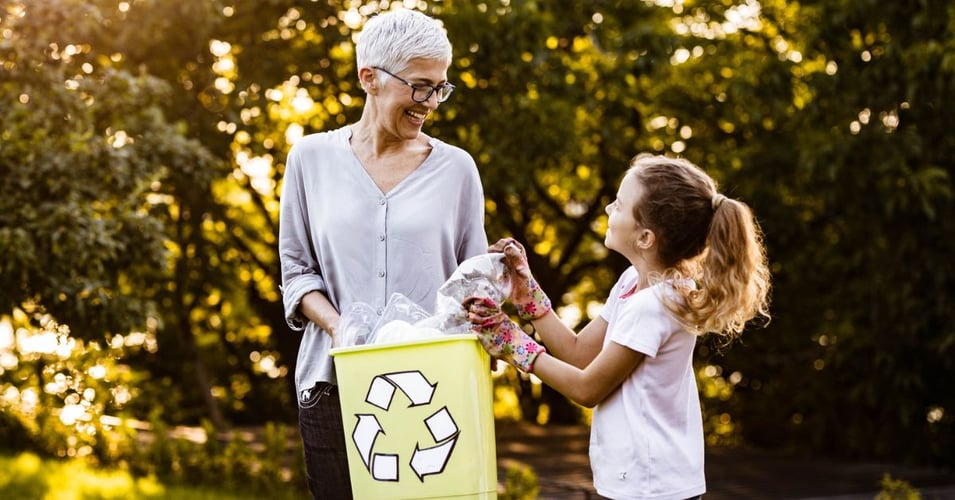 a senior woman and granddaughter clean up and recycle together, sustainability blog header pacifica senior living